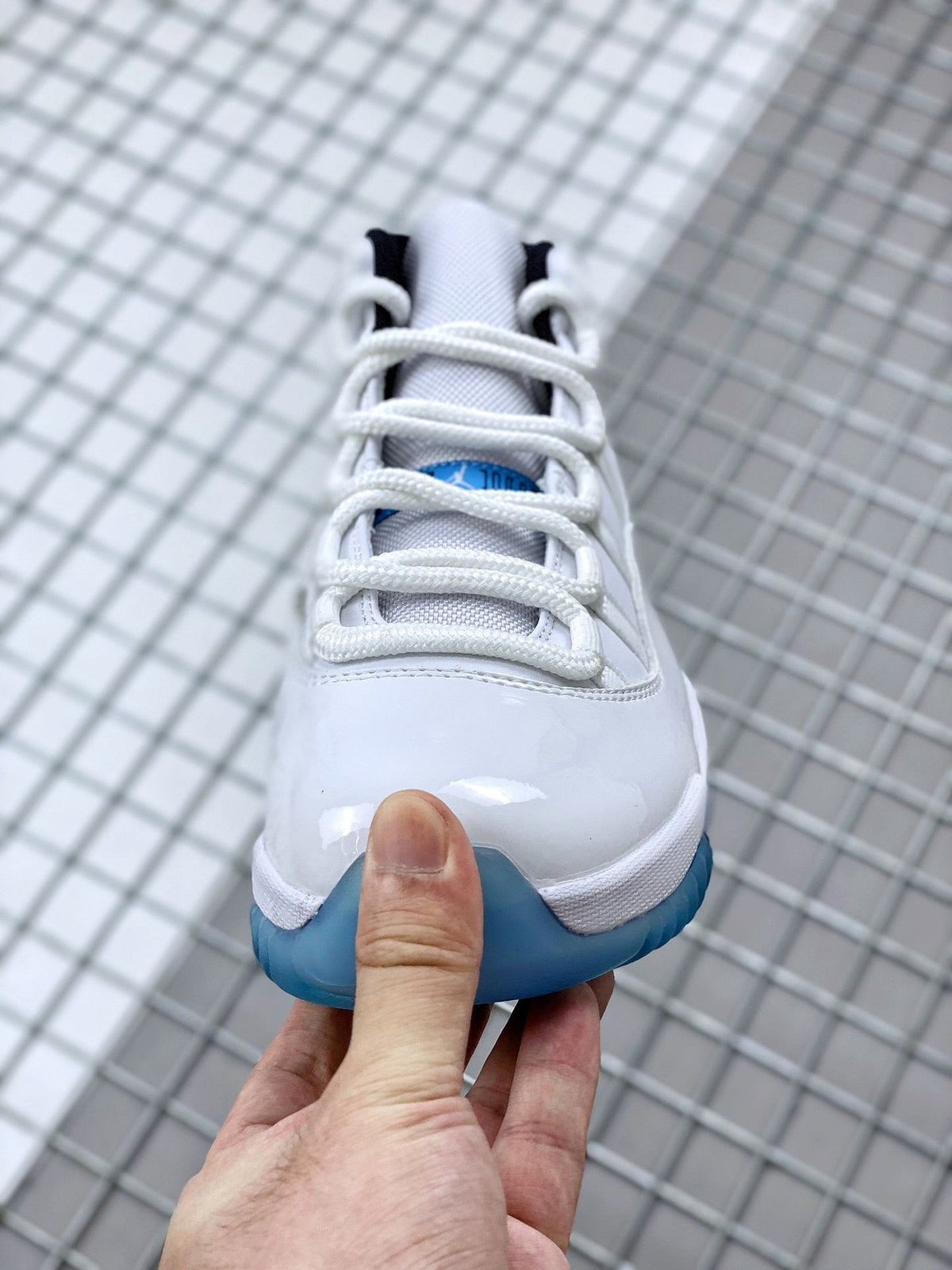 Jordan 11 Legend Blue Sneakers in White Blue 378037-117 - product image from the listing.