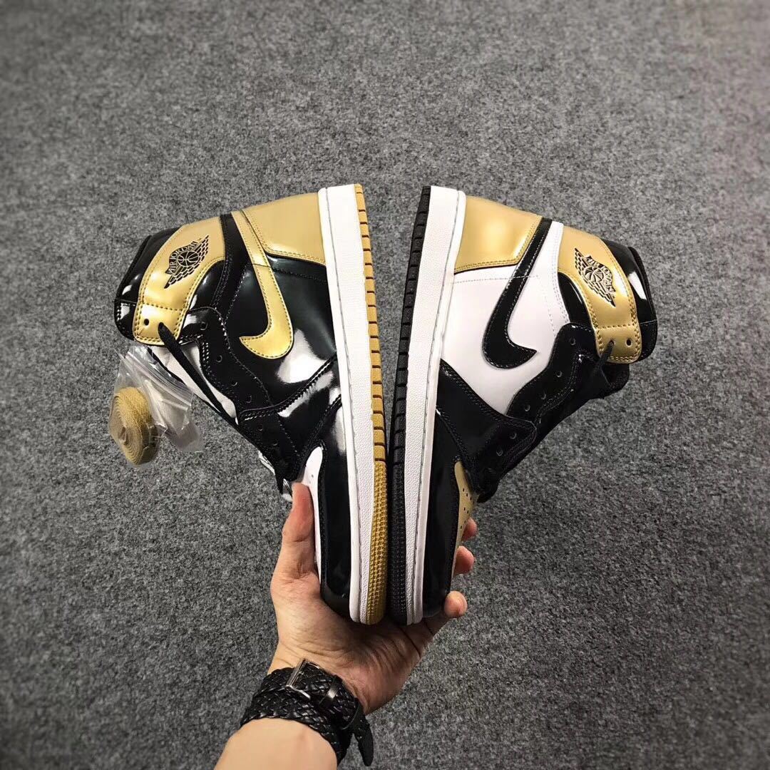 Jordan 1 High Mismatched Sneakers in Black Gold White - product image from the listing.