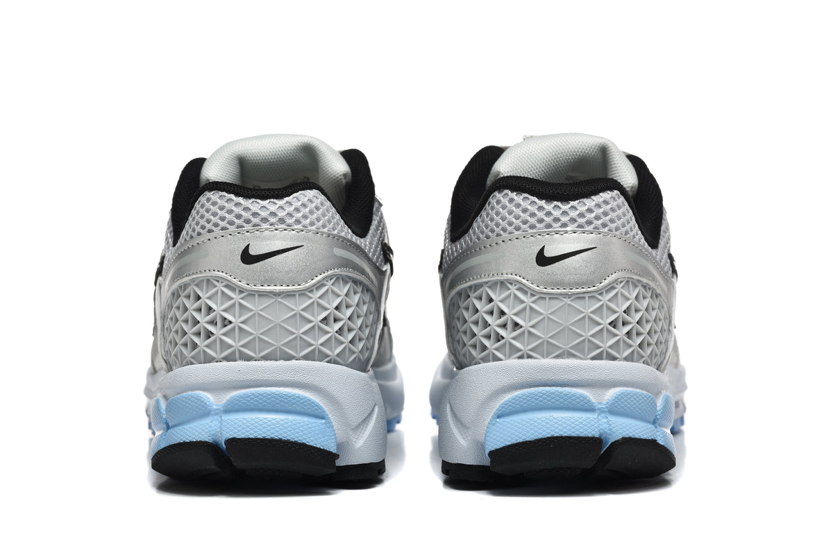 Nike Vomero 5 Sneakers in Silver and Light Blue - product image from the listing.