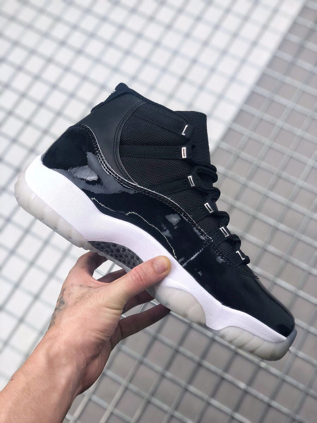 Air Jordan 11 Silver Eyelets Black White Sneakers - product image from the listing.