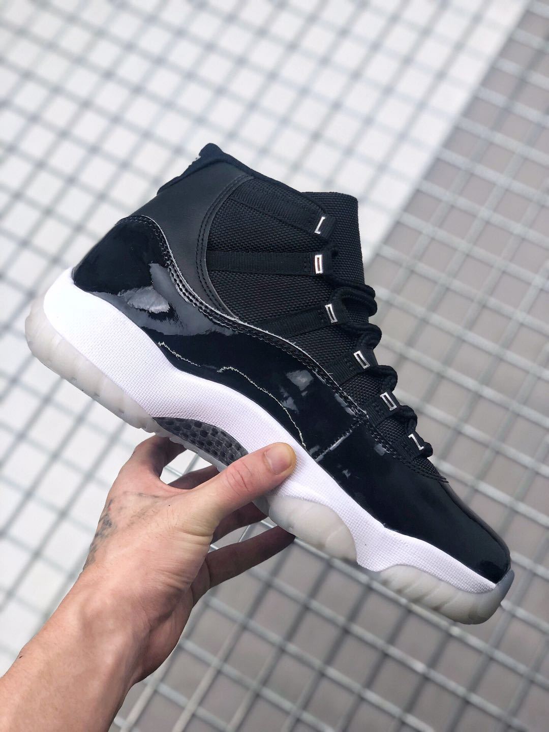 Air Jordan 11 Silver Eyelets Black White Sneakers - product image from the listing.