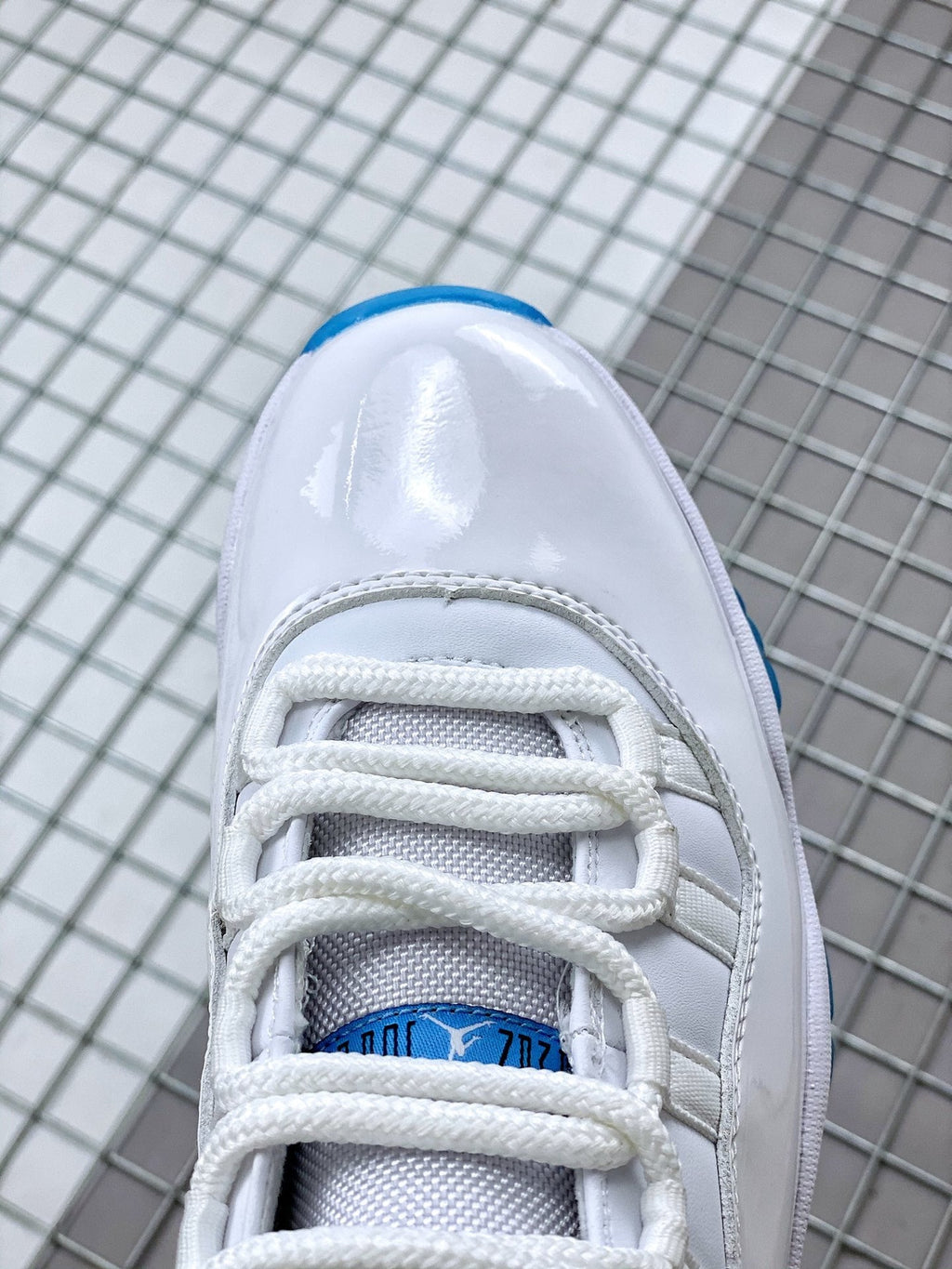 Jordan 11 Legend Blue Sneakers in White Blue 378037-117 - product image from the listing.