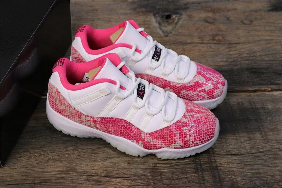 Women's Air Jordan 11 Retro Low Pink Snakeskin Sneakers - product image from the listing.