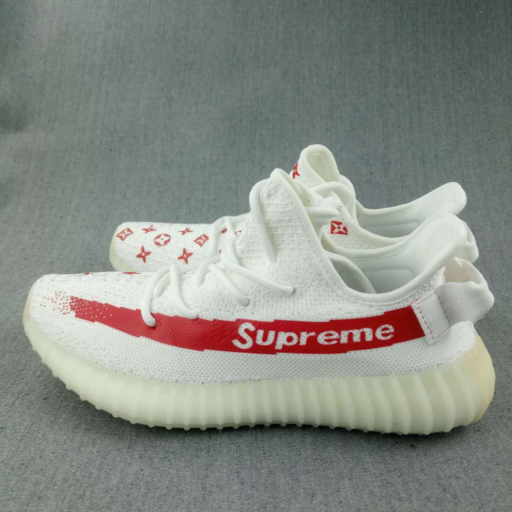 Yeezy 350 V2 Low-Top Sneakers in White and Red - product image from the listing.