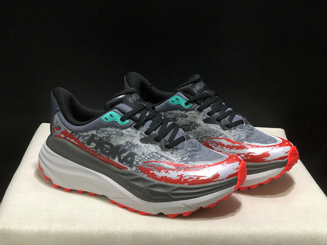 HOKA Stinson 7 Trail Running Shoes in Gray Red - product image from the listing.