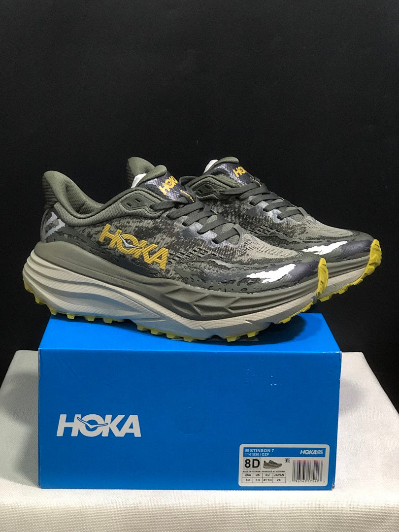 HOKA Stinson 7 Trail Running Shoes, in Gray and Yellow - product image from the listing.