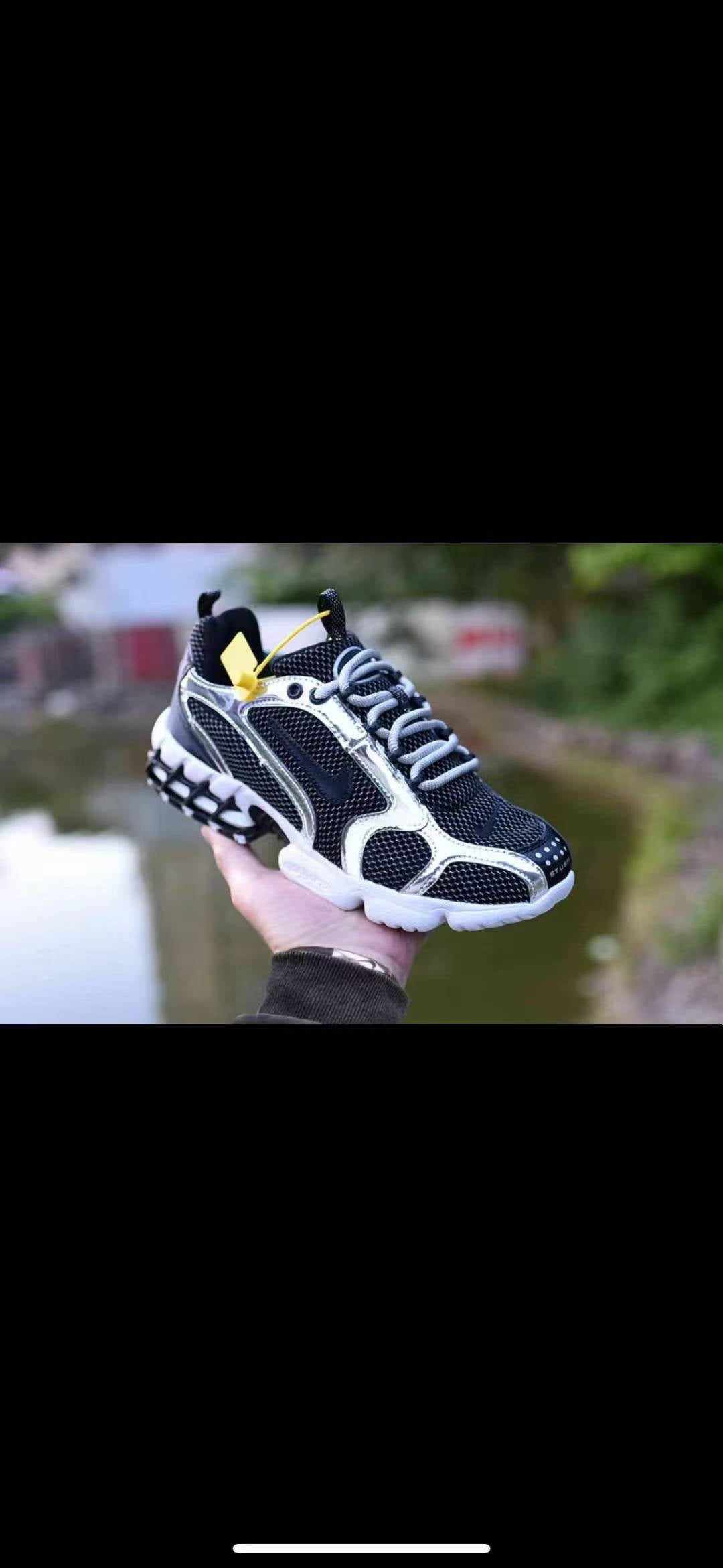 Nike Black and White Chunky Trainers with Yellow Accent - product image from the listing.