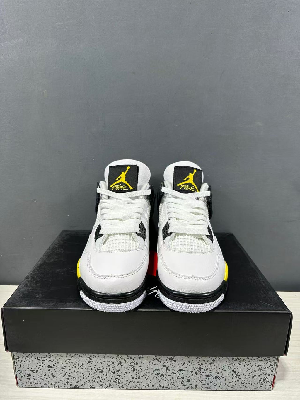 Air Jordan 4 Retro White Yellow Black Sneakers IO2468-102 - product image from the listing.