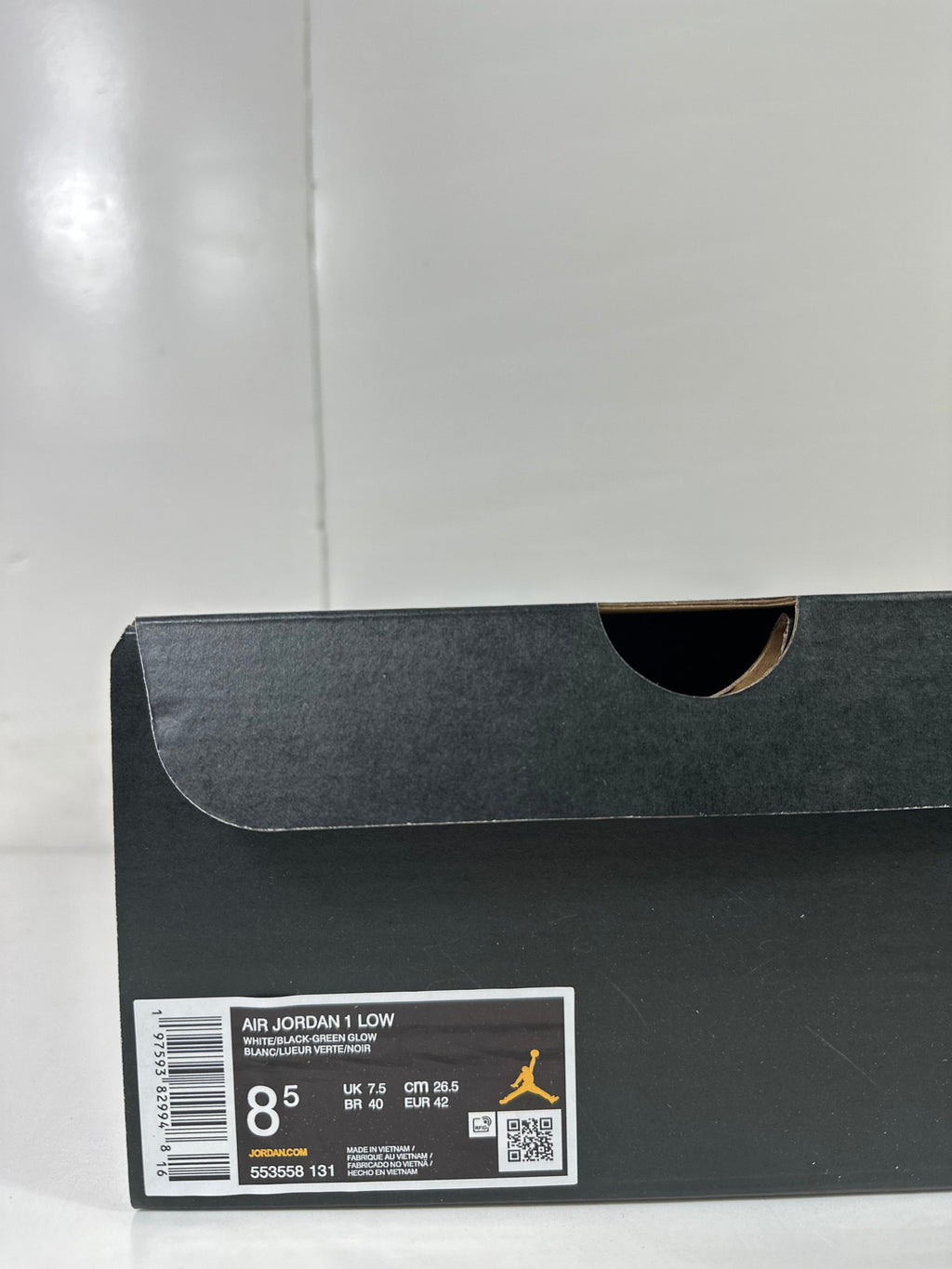 Air Jordan 1 Low White Green Black Sneakers 553558-131 - product image from the listing.