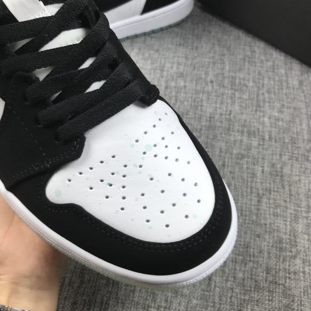 Air Jordan 1 Mid Sneakers in Black White Mint BQ6931-103 - product image from the listing.