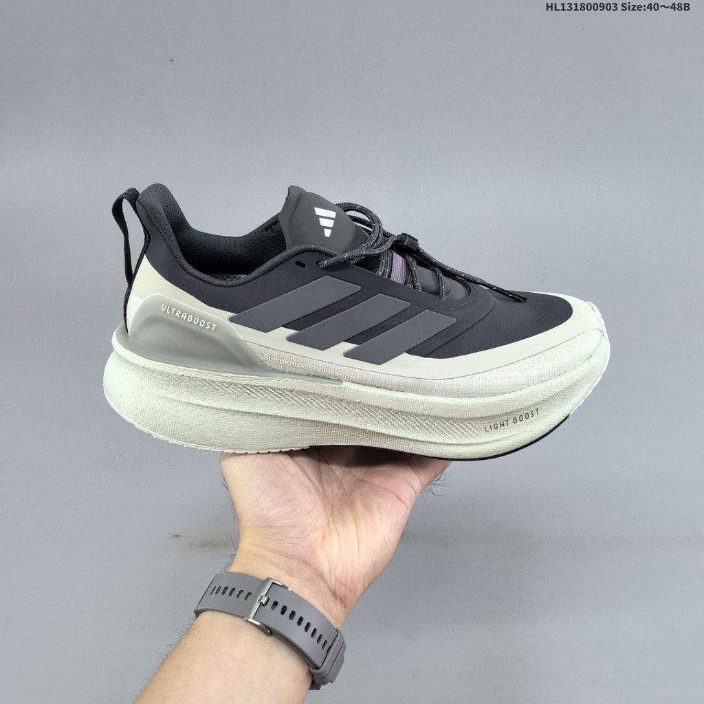 Adidas Ultraboost 5 Running Shoes, in Charcoal and Cream - product image from the listing.