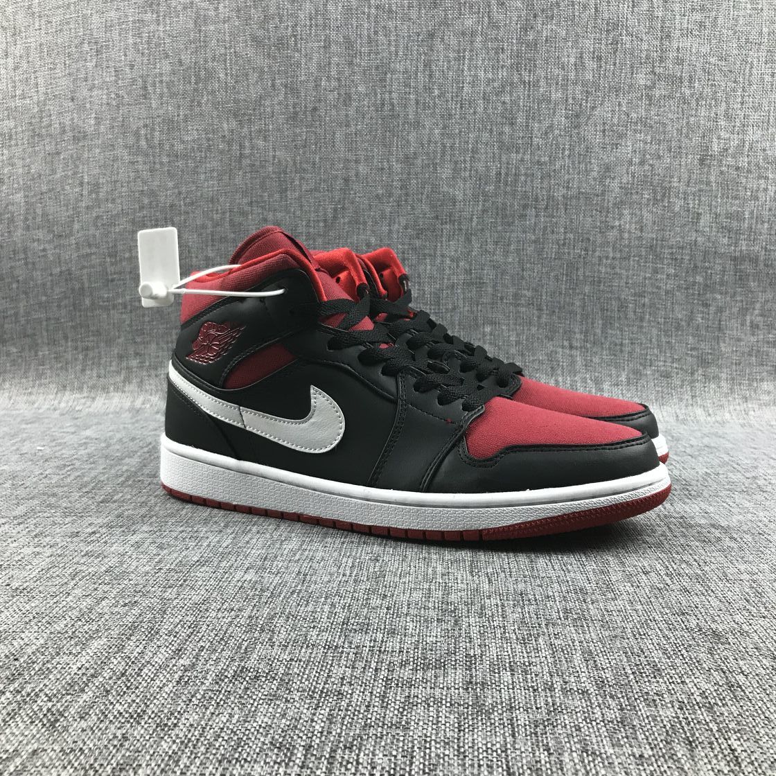 Black Red Canvas-Style Sneakers - Jordan 1 Mid 554724-020 - product image from the listing.
