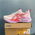 ASICS NOVABLAST 5 LE Running Shoes in Pink and Orange - product image from the listing.