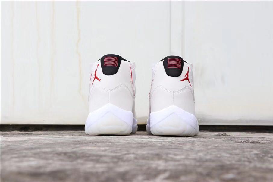 Air Jordan 11 Platinum Tint White High-Top Sneakers - product image from the listing.