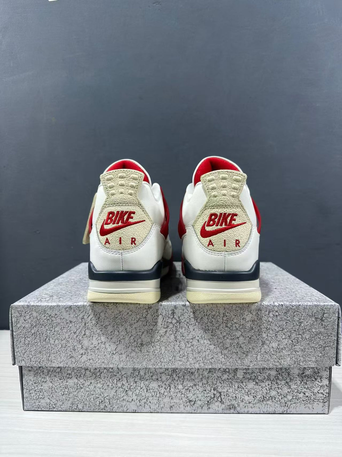 Air Jordan 4 Retro White Red Sneakers - product image from the listing.
