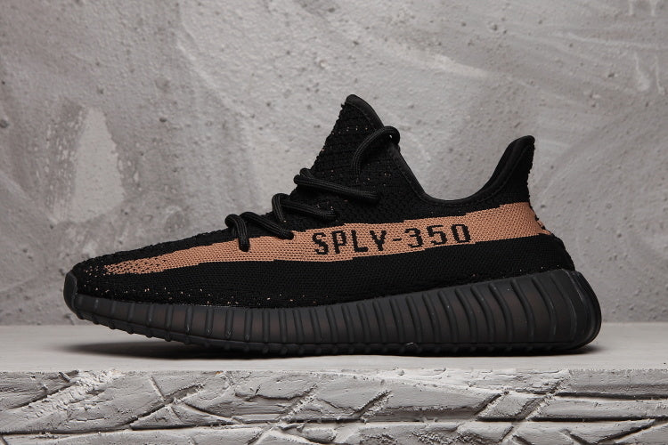Yeezy Boost 350 V2 Sneakers in Black and Tan - product image from the listing.