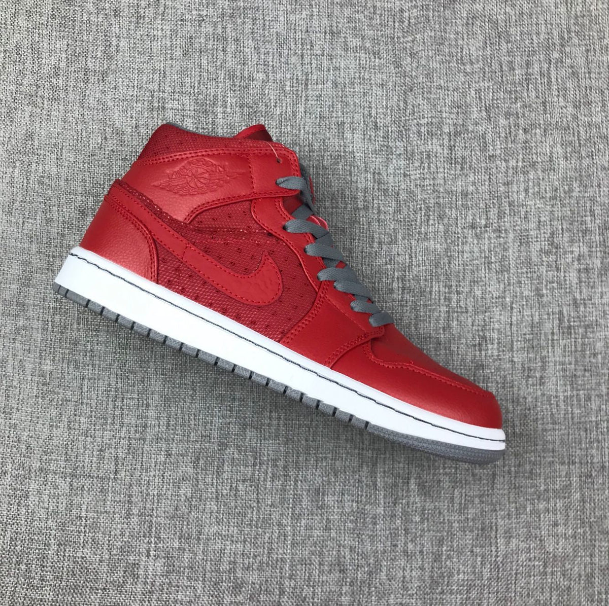 Red and Grey Jordan 1 Mid High-Top Sneakers - product image from the listing.