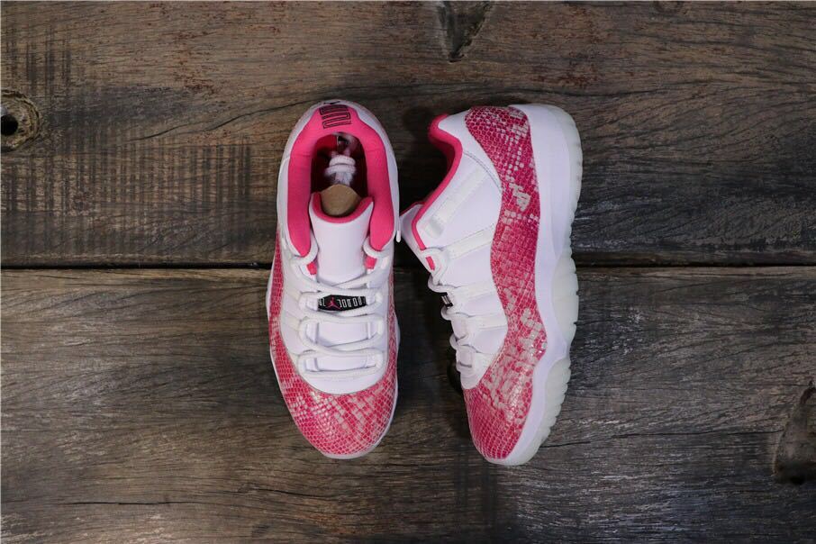 Women's Air Jordan 11 Retro Low Pink Snakeskin Sneakers - product image from the listing.