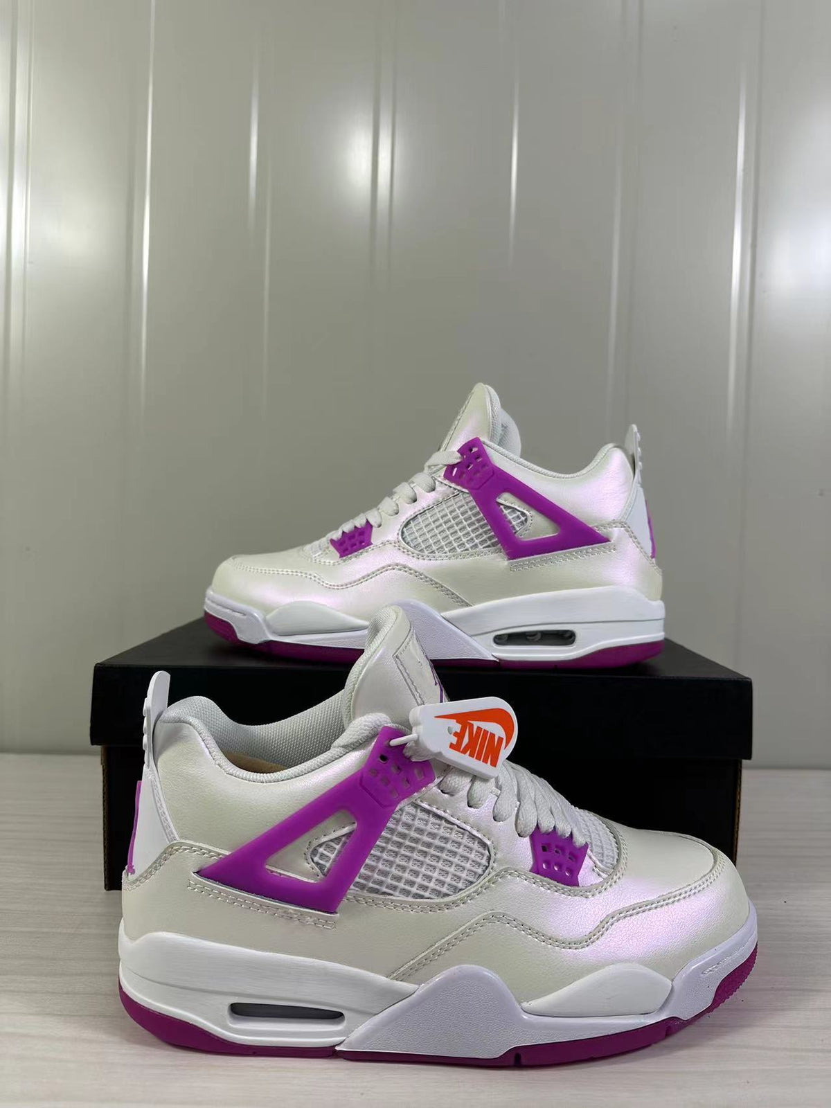 Air Jordan 4 Retro Hyper Violet Sneakers FQ1314-151 - product image from the listing.