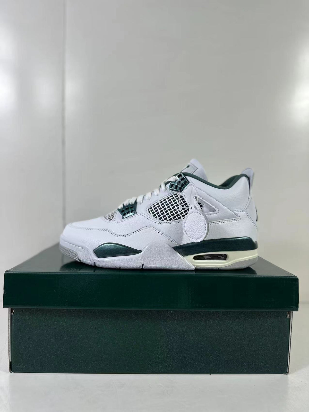 Air Jordan 4 Retro Bucks White Green Sneakers FQ8138-103 - product image from the listing.