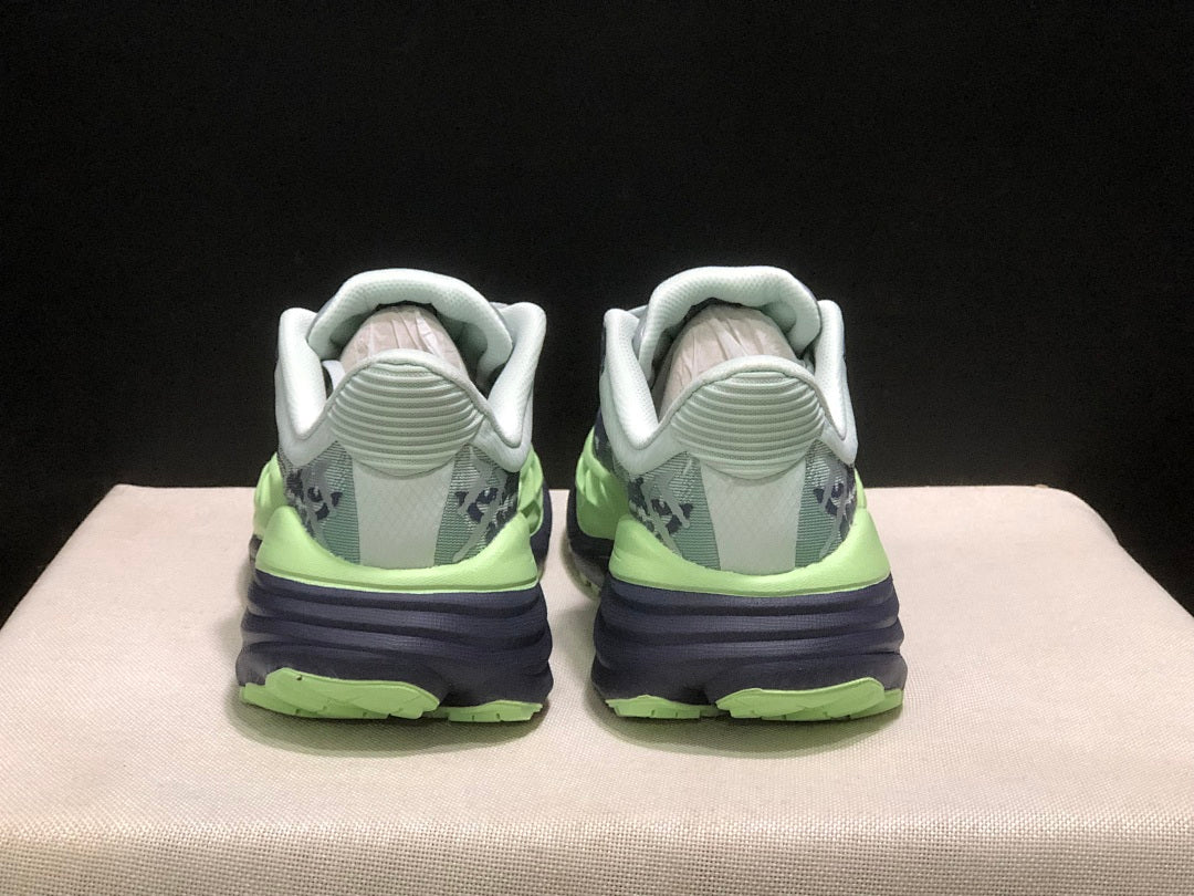 HOKA Stinson 7 Trail Running Shoes, in Green and Navy - product image from the listing.