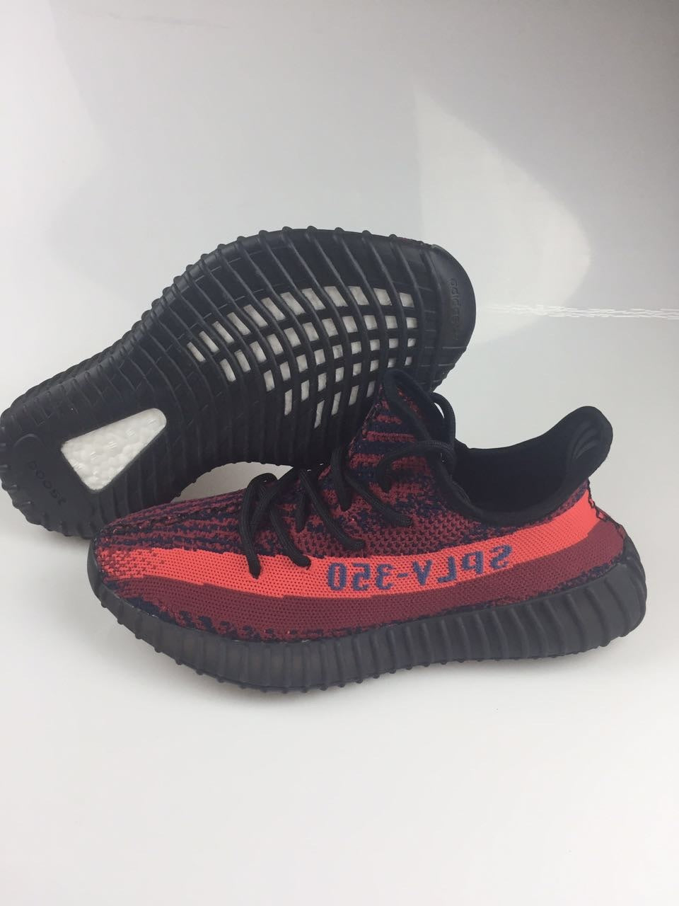 Adidas Yeezy Boost 350 V2 Sneakers in Black and Burgundy - product image from the listing.