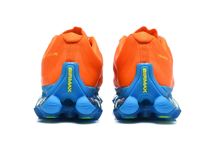 Nike Air Max Plus Sneakers in Orange and Blue - product image from the listing.
