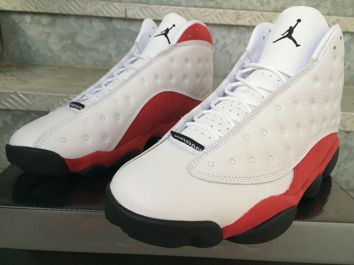 Air Jordan 13 Sneakers in White Red Black - product image from the listing.