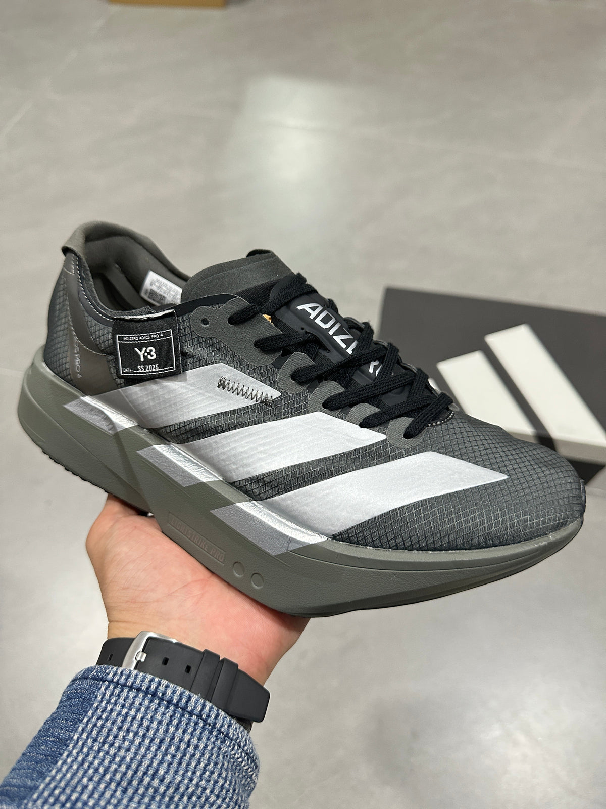 Adidas Adizero Adios Pro 4 Running Shoes in Grey Black - product image from the listing.