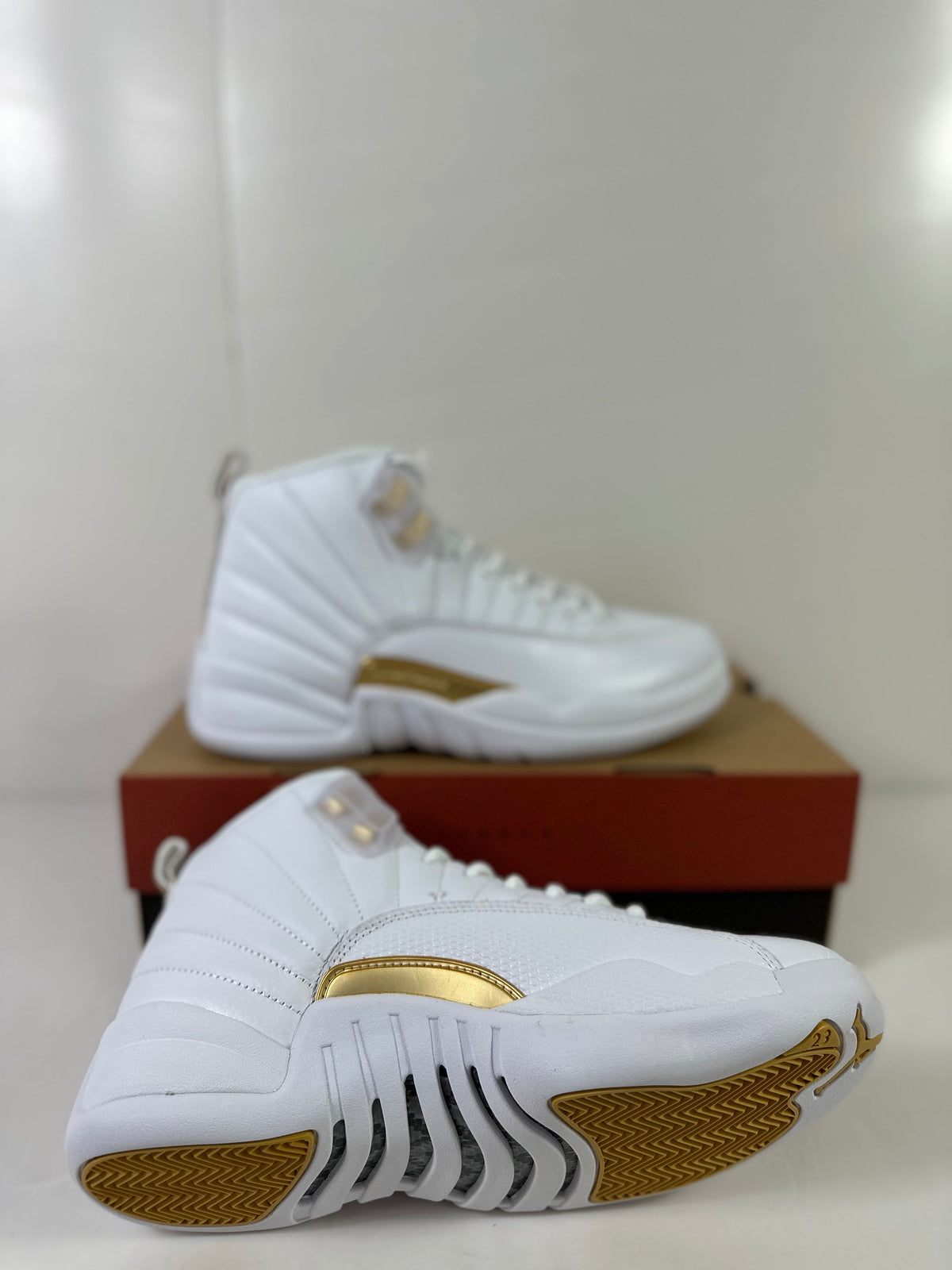 Air Jordan 12 Phantom White Metallic Gold Sneakers FD9101-007 - product image from the listing.