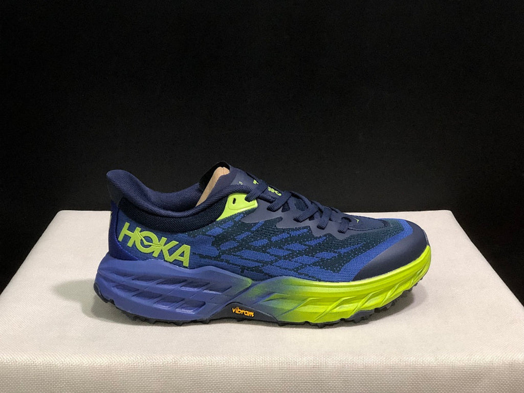 HOKA Speedgoat 5 Trail Running Shoes, in Navy and Lime - product image from the listing.