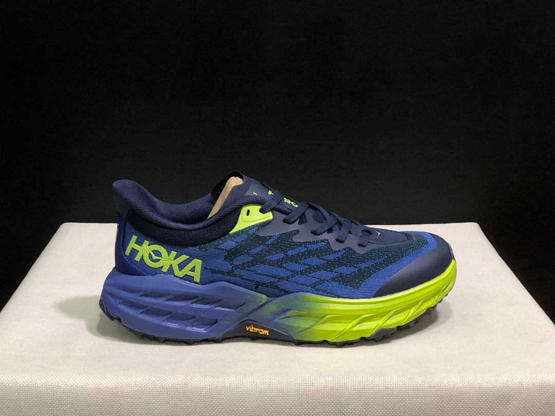 HOKA Speedgoat 5 Trail Running Shoes, in Navy and Lime - product image from the listing.