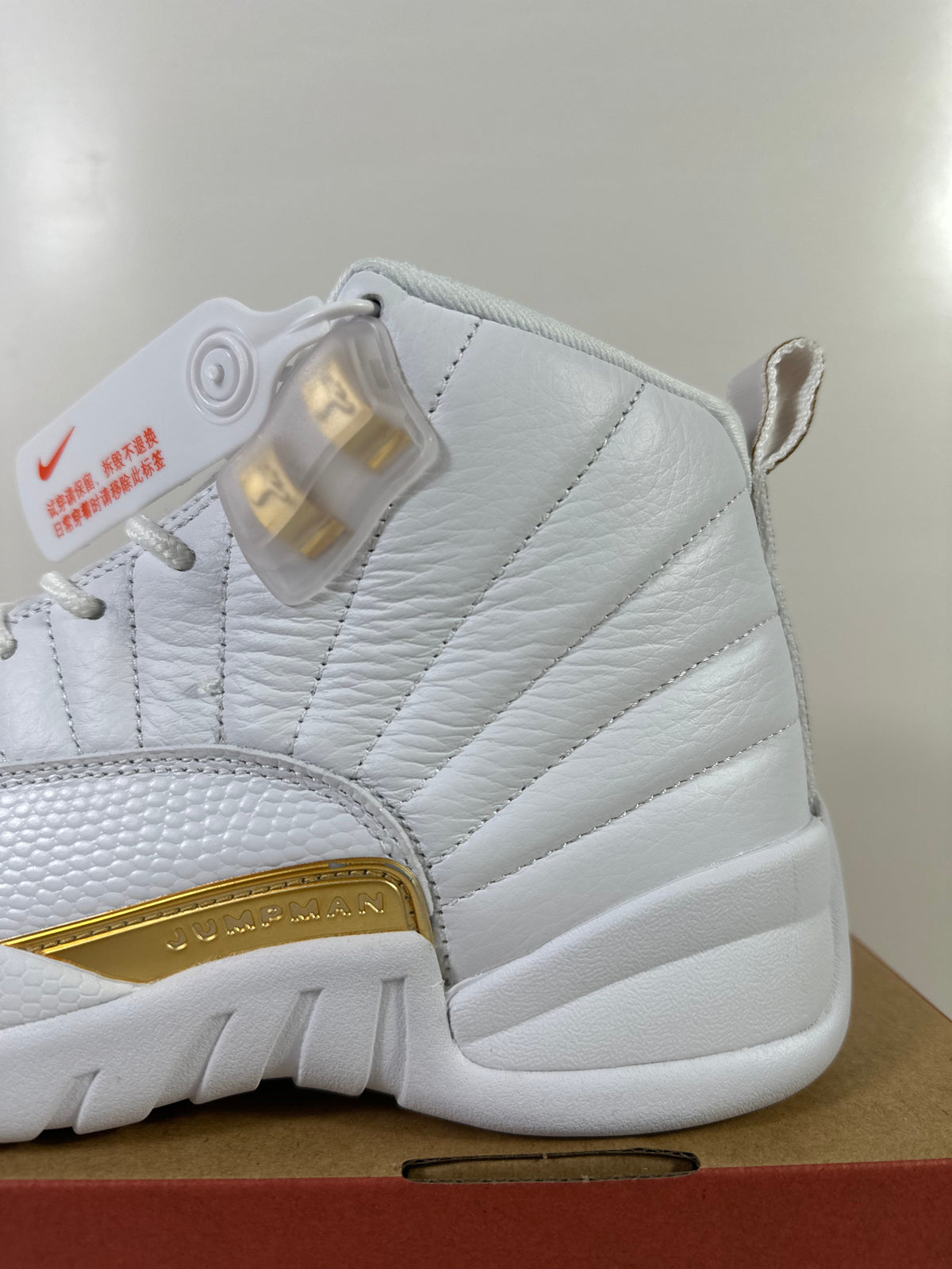 Air Jordan 12 Phantom White Metallic Gold Sneakers FD9101-007 - product image from the listing.