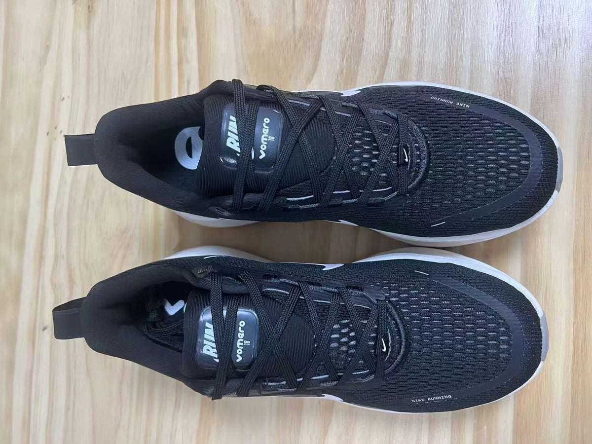 Nike Vomero 18 Running Shoes in Black and White - product image from the listing.