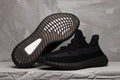 Yeezy 350 V2 Low-Top Sneakers in Black - product image from the listing.