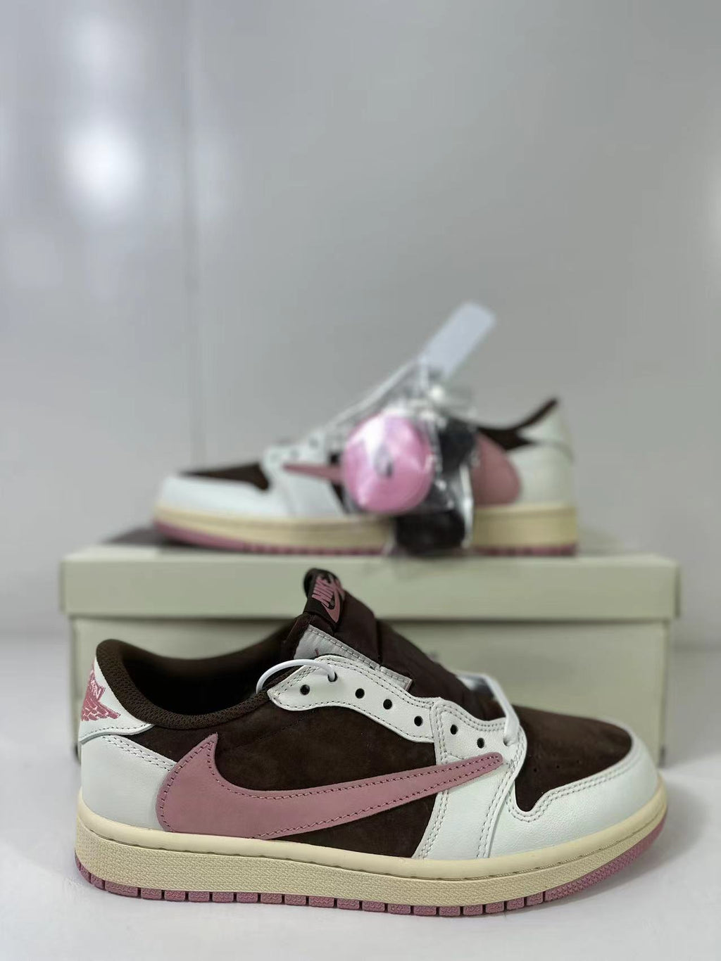 Jordan 1 Low Travis Scott in Brown White Pink DZ4137-206 - product image from the listing.
