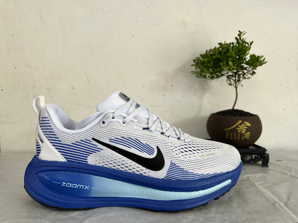 Nike Vomero 18 Running Shoes, in White and Blue - product image from the listing.