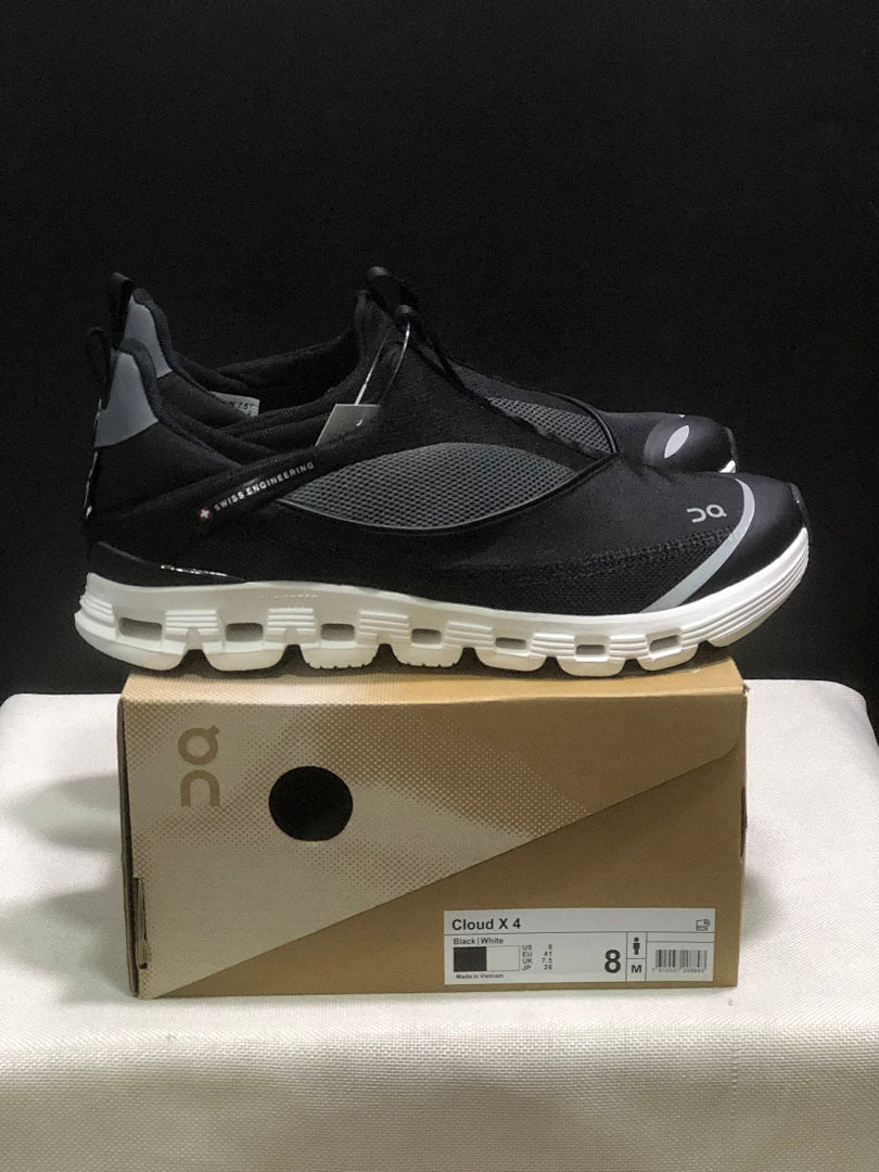 On Cloud X 4 Coast Sneakers in Black and White - product image from the listing.