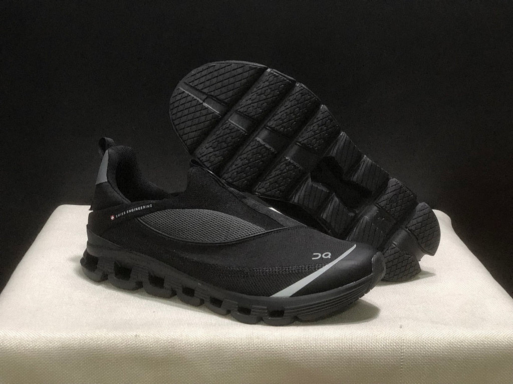 On Cloud 4 Coast Black Slip-On Trainers - product image from the listing.