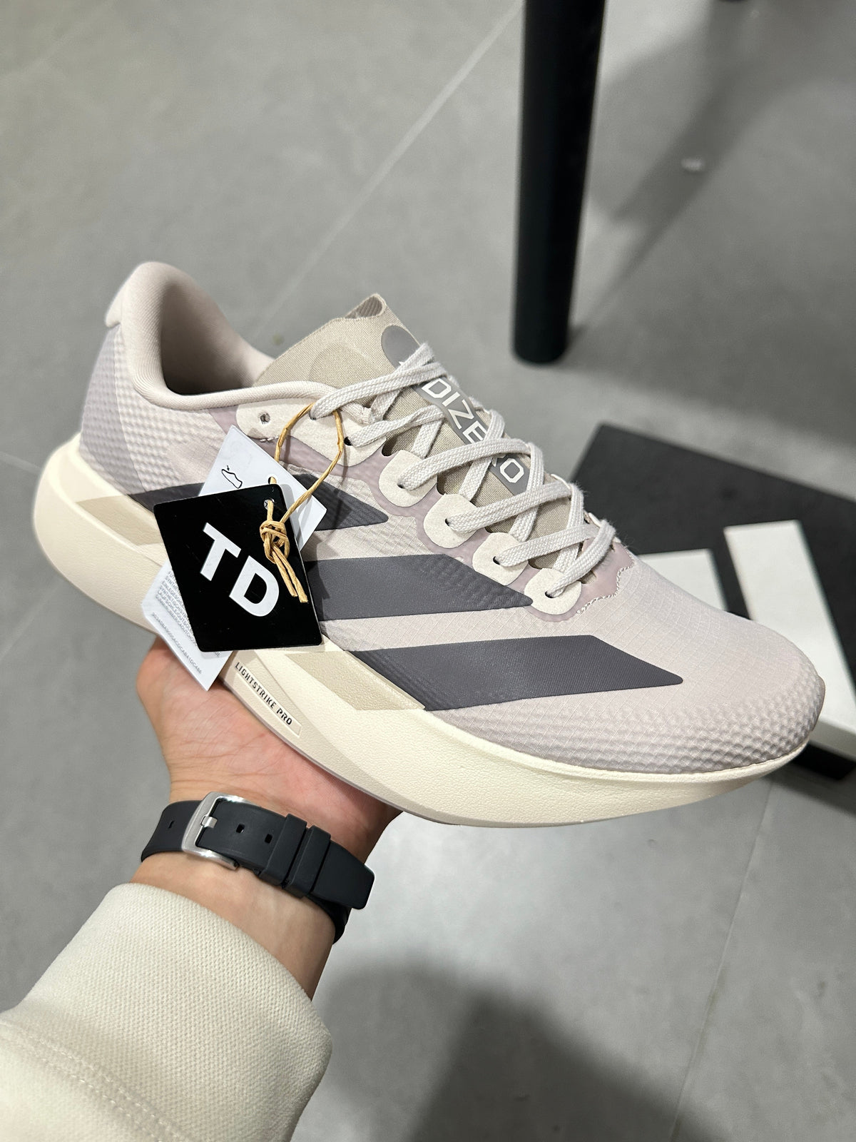 Adidas Lightstrike Pro Running Shoes in White and Gray KJ2001 - product image from the listing.