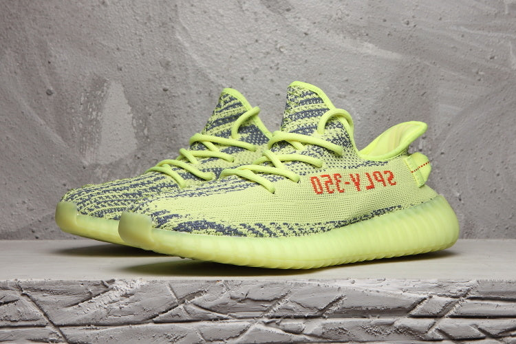 Lime Green and Charcoal Yeezy Boost 350 V2 Sneakers - product image from the listing.