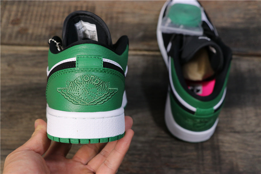Jordan 1 Low Sneakers in Black Green 553558-113 - product image from the listing.
