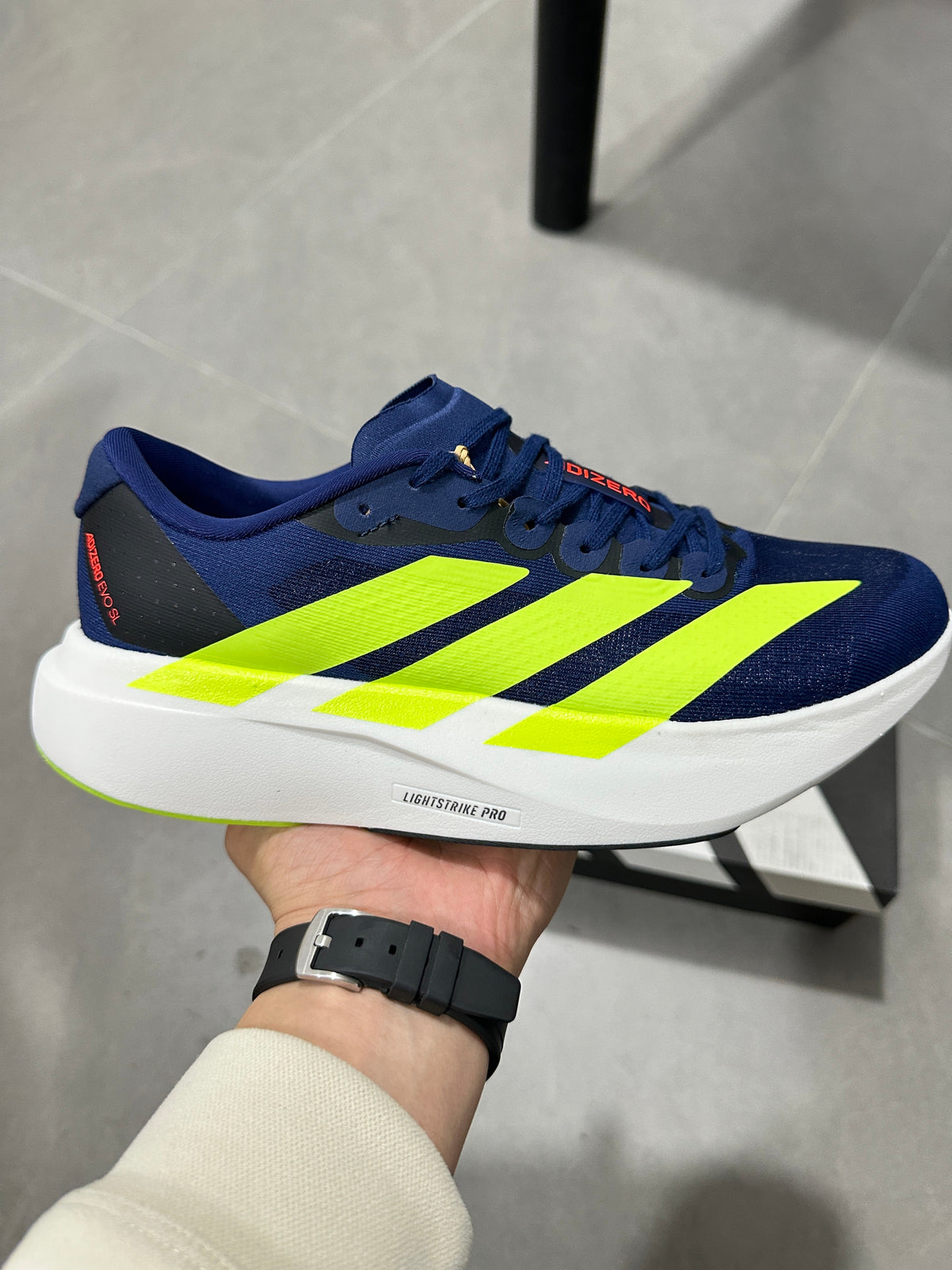 Adidas Lightstrike Pro Running Shoes in Navy Volt - product image from the listing.
