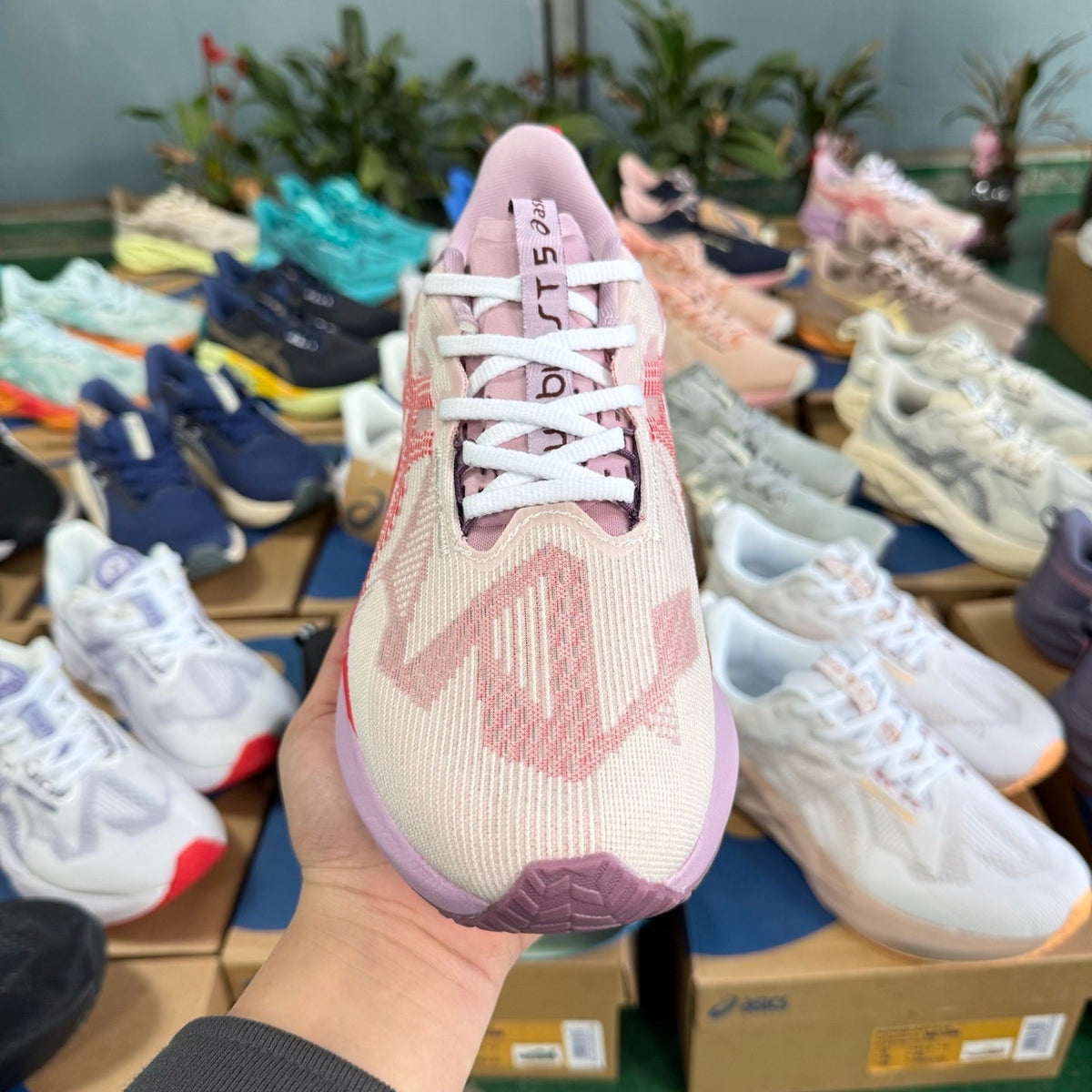 ASICS NOVABLAST 5 LE Running Shoes in Pink and Orange - product image from the listing.