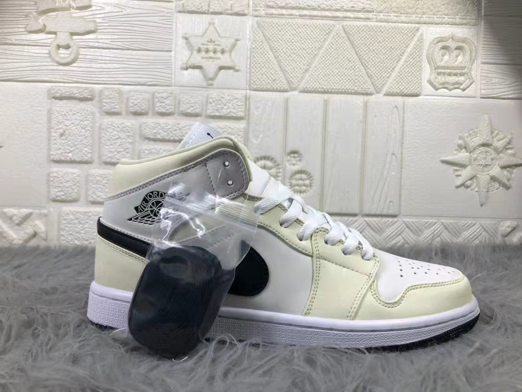 Jordan Air 1 Mid Sneakers in Cream White and Black - product image from the listing.