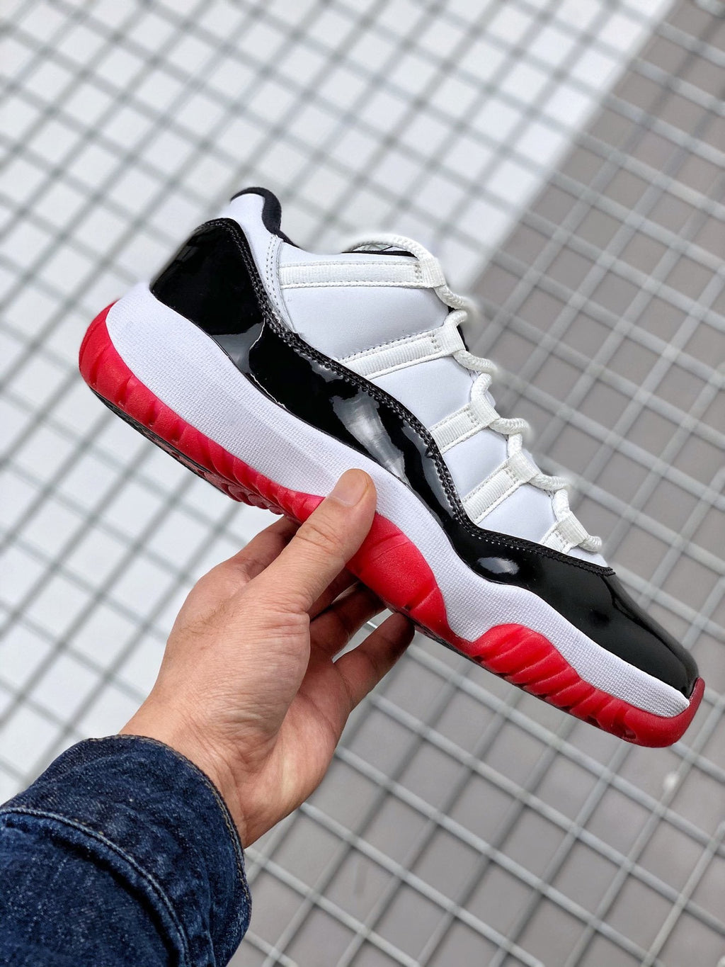 Air Jordan 11 Win Like '82 Sneakers in White Black Red - product image from the listing.