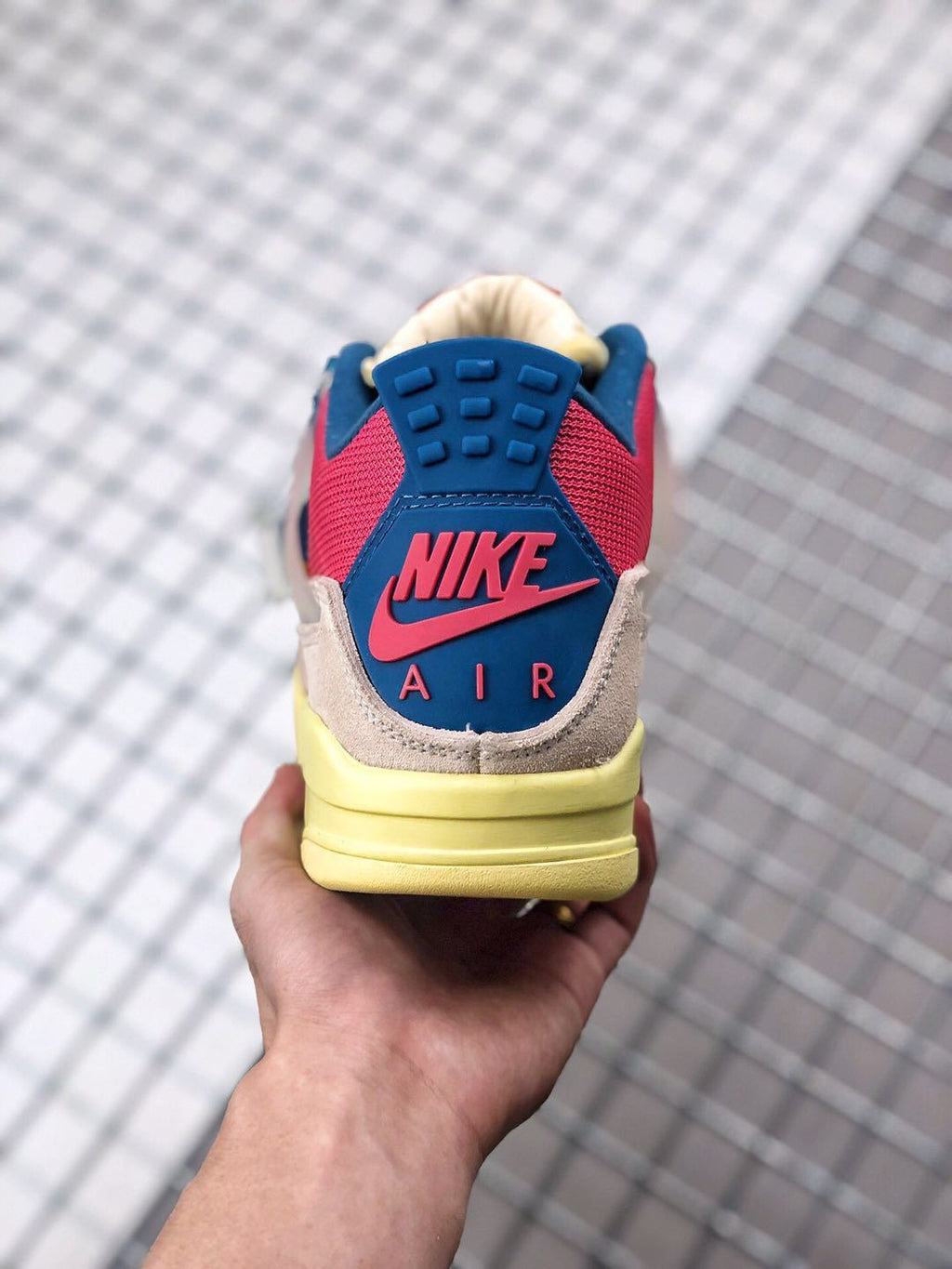 Union x Air Jordan 4 Sneakers in Pink Beige Navy Yellow - product image from the listing.