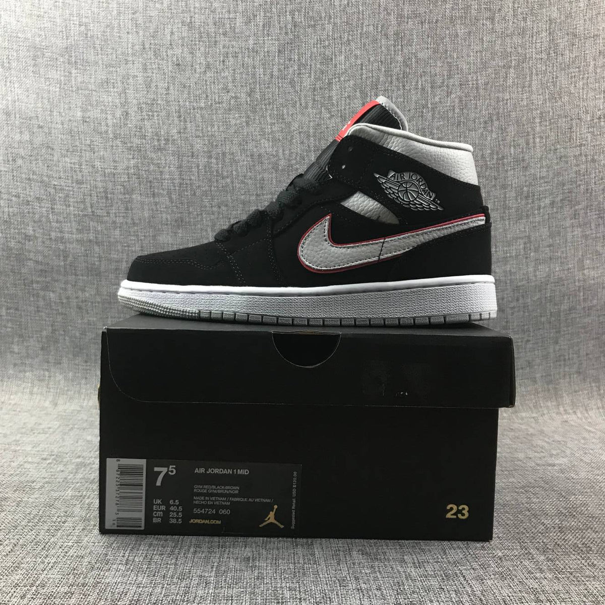 Air Jordan 1 Mid Black, Sneakers in White & Red 554724-060 - product image from the listing.