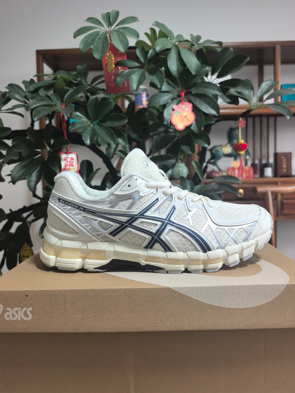 ASICS GEL-NANDI 9 Sneakers in Cream and Blue - product image from the listing.