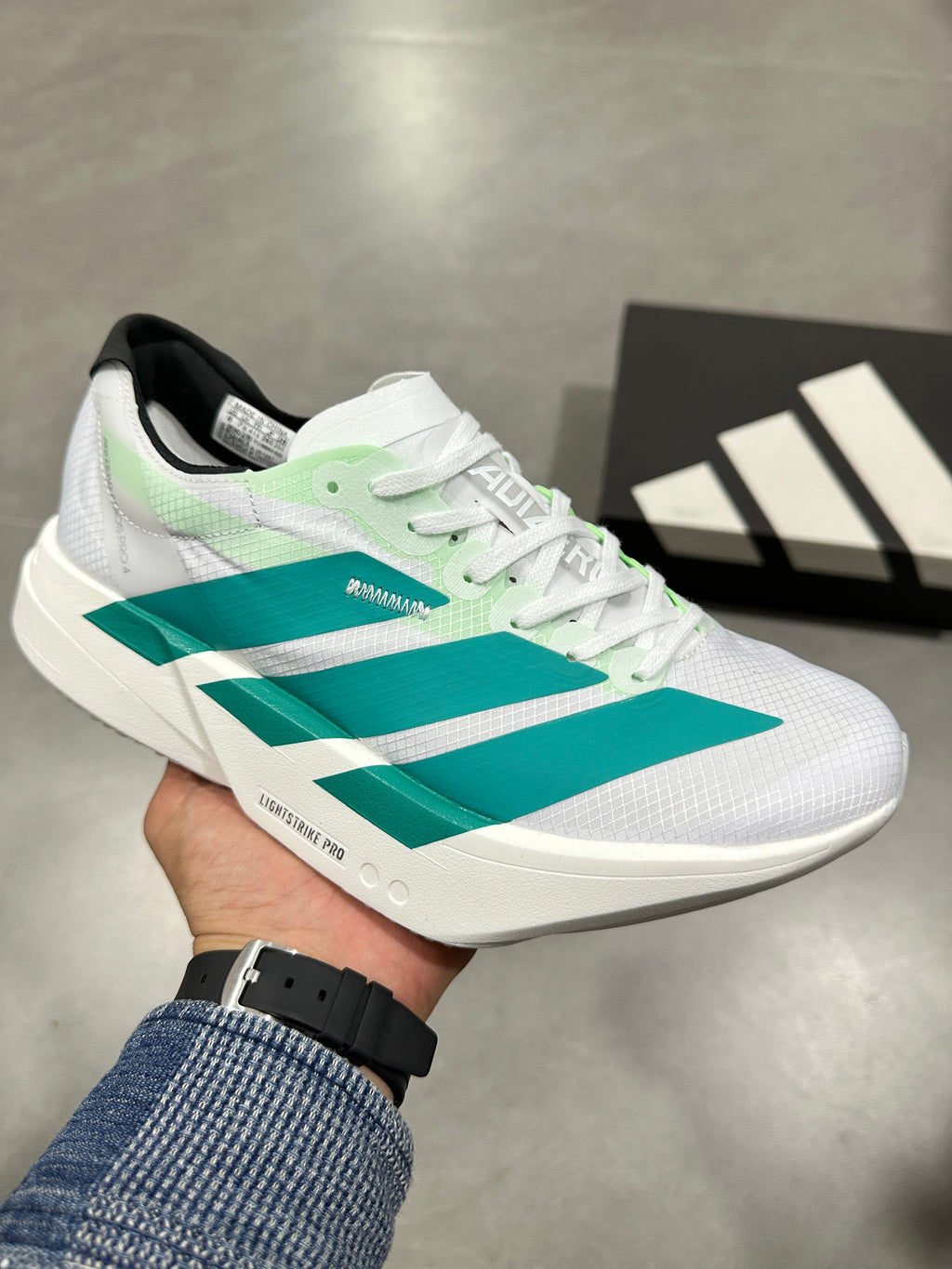 Adidas Adizero Lightstrike Pro Running Shoes in White Teal - product image from the listing.